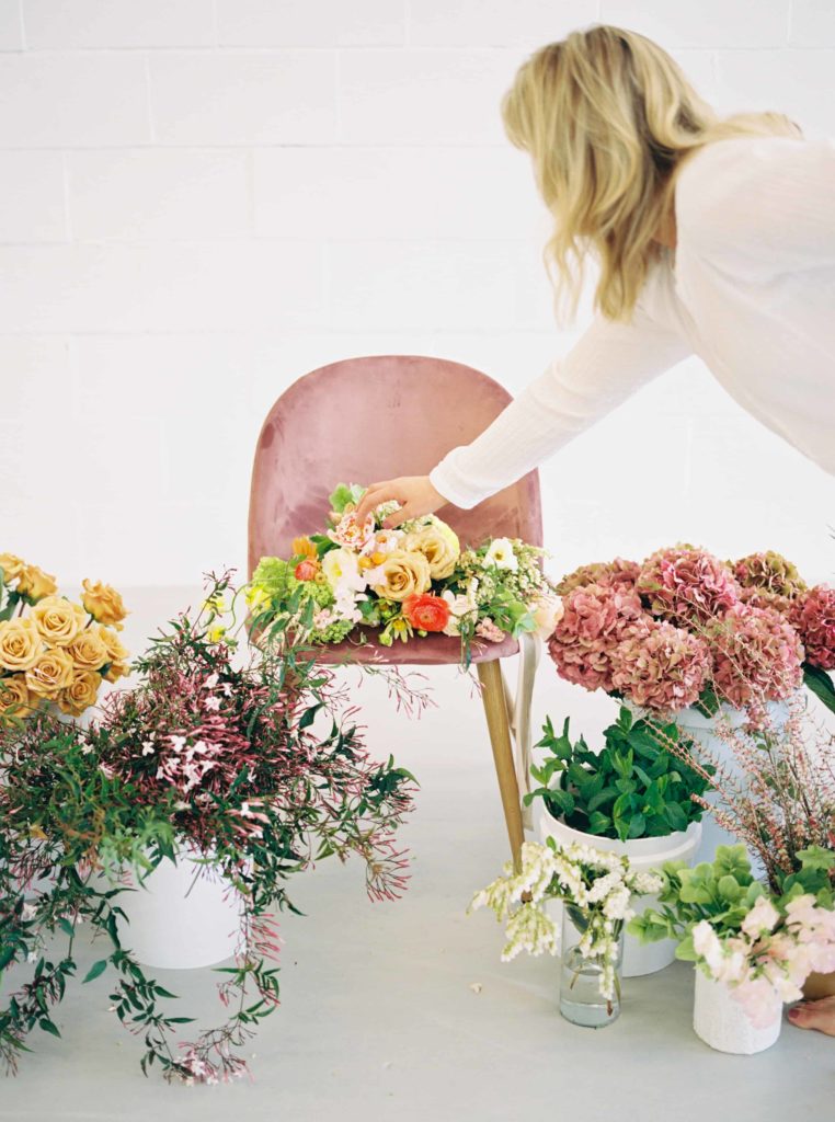 Wedding florist arranges flowers